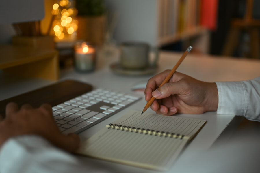 closeup-businessman-writing-notes-in-personal-dail-2024-12-02-08-52-18-utc-900x600